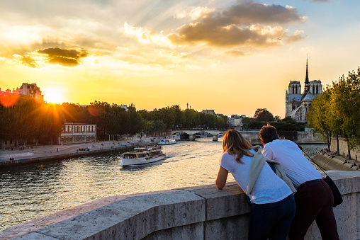 France, Paris, the banks of the Seine river listed as World Heritage by UNESCO, Notre Dame Cathedral, Ile de la Cite, at sunset, view from Tournelle bridge