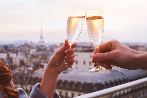 couple drinking champagne in Paris